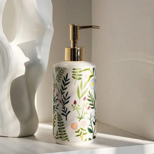 Decorative ceramic soap dispenser with floral design for bathroom decor