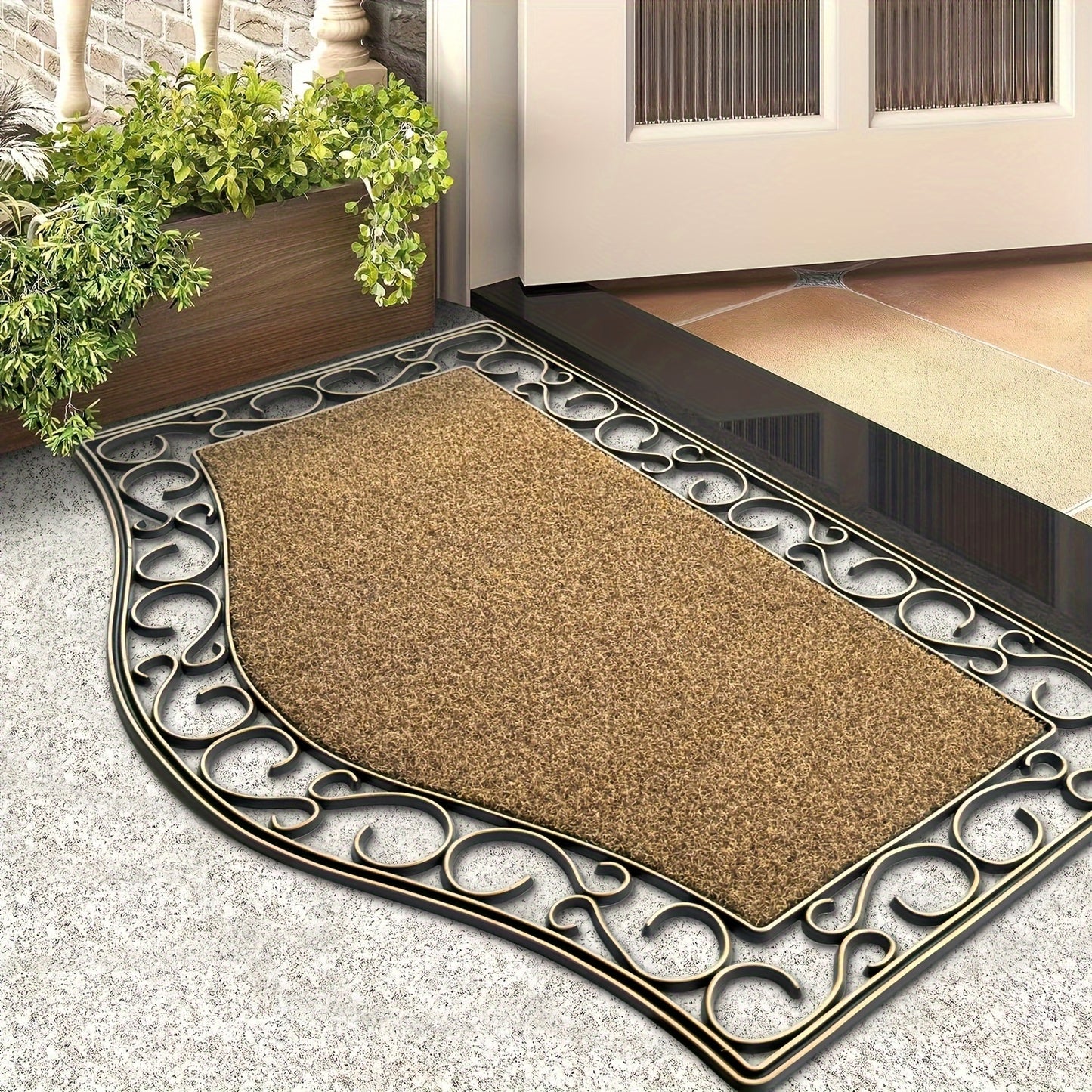 Decorative doormat with ornate border on a stone floor