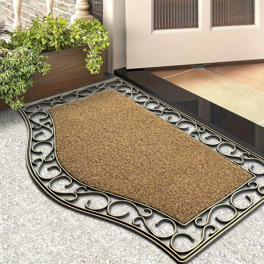Decorative doormat with ornate border on a stone floor